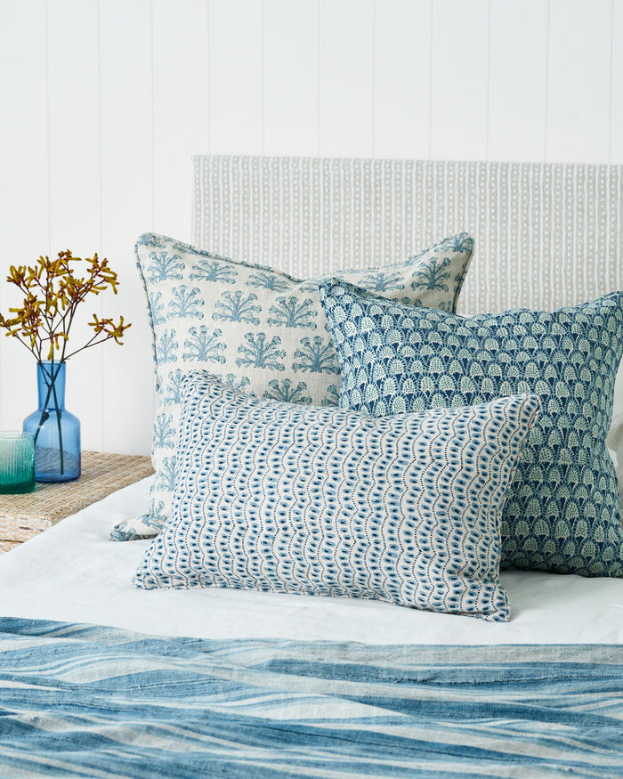 Amulet Azure Lumbar Pillow Cover on bed