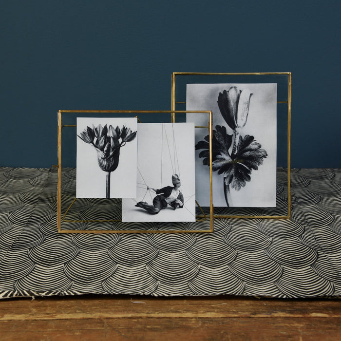 Brass Easel Vertical Frame styled with black and white art