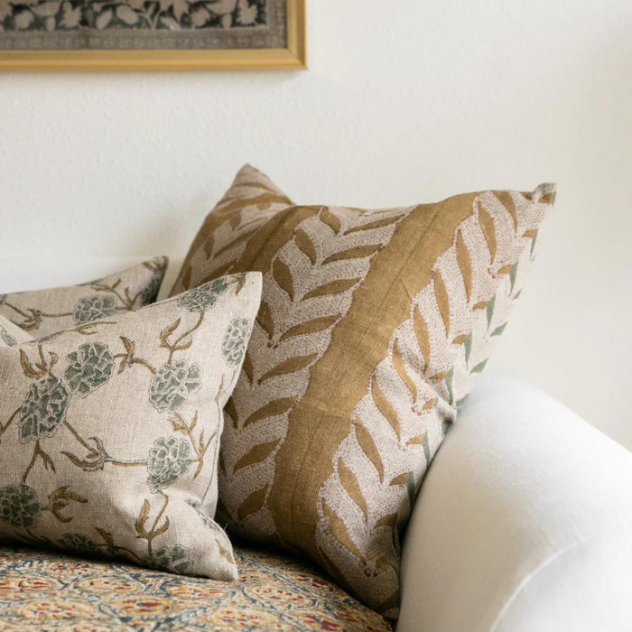 Claire Mustard Pillow Cover styled on sofa