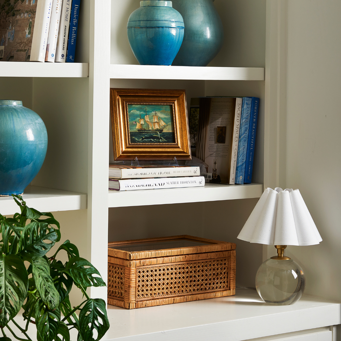 Framed Sperm Whale and Sailing Ship styled on shelf with coastal decor
