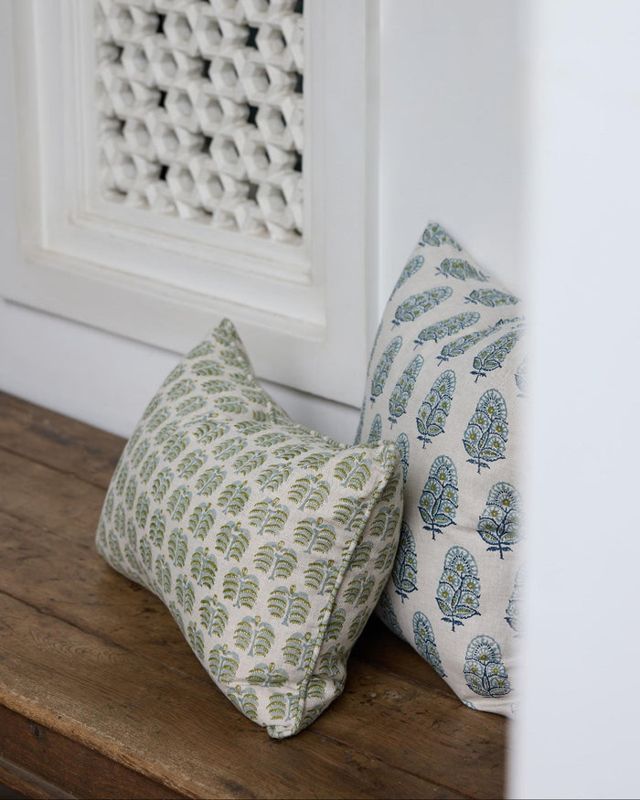 Hera Moss Celadon Lumbar Pillow Cover on wood bench