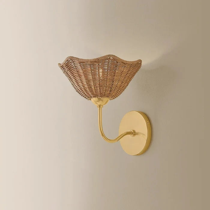 Kehlani Scalloped Edge Rattan Wall Sconce illuminated