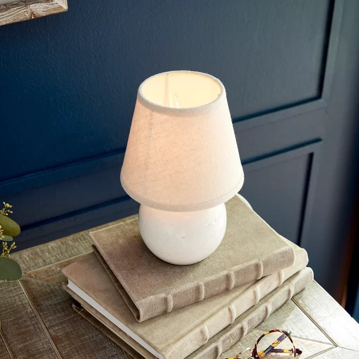 Landry Off White Mini Lamp on book stack