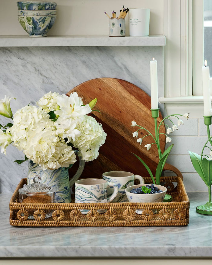 Marbled Ocean Mugs styled with pitcher in rattan tray