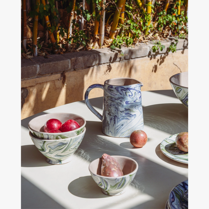Marbled Ocean Pitcher styled on outdoor table with bowls