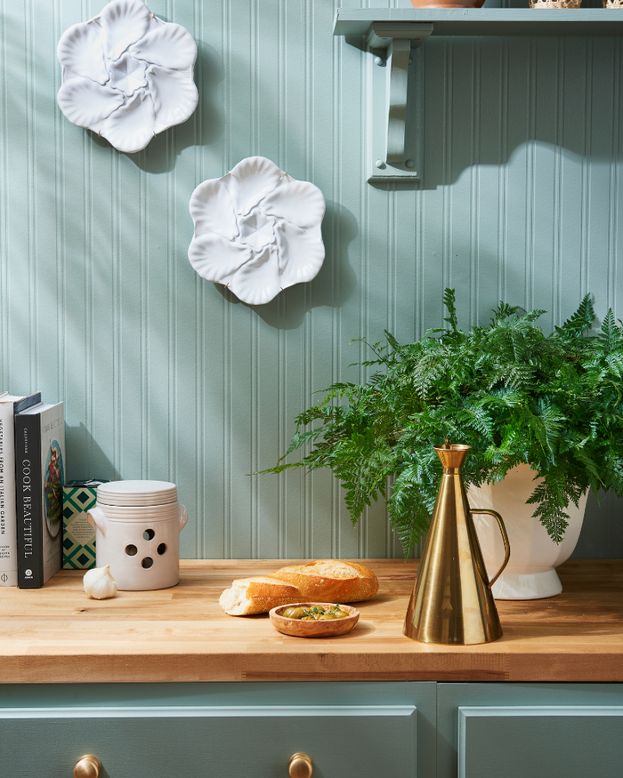 Poloma Oil Cruet and White Oyster Plates Styled On Wall - Dear Keaton