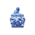 Blue and white ceramic jar with lid featuring a lion design on a white background