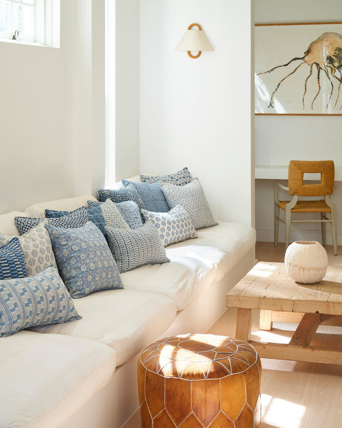 Simrane Azure Pillow Cover styled with Walter Blue pillows on white sofa