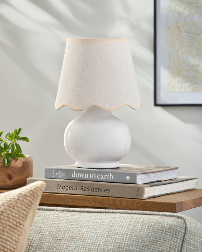 Skyler Mini Lamp on side table with stack of books