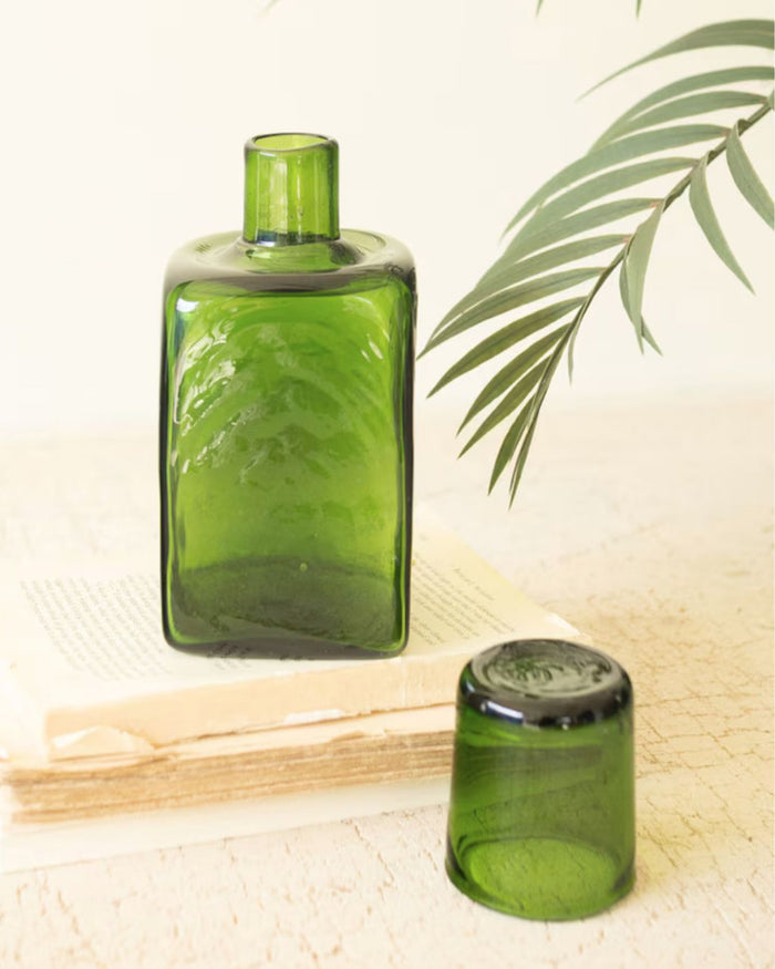green glass carafe and water glass