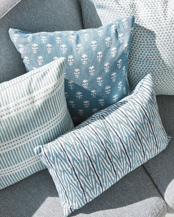 Fuji Sky and Yukka Outdoor Pillow Covers styled on patio